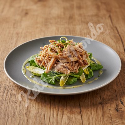 Shredded duck confit on warm salad